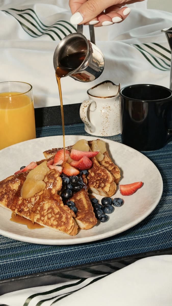 Maple syrup poured over French toast